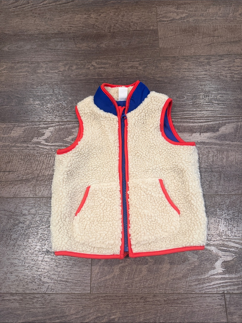 Old Navy Cream Sherpa Vest with Blue and red trim